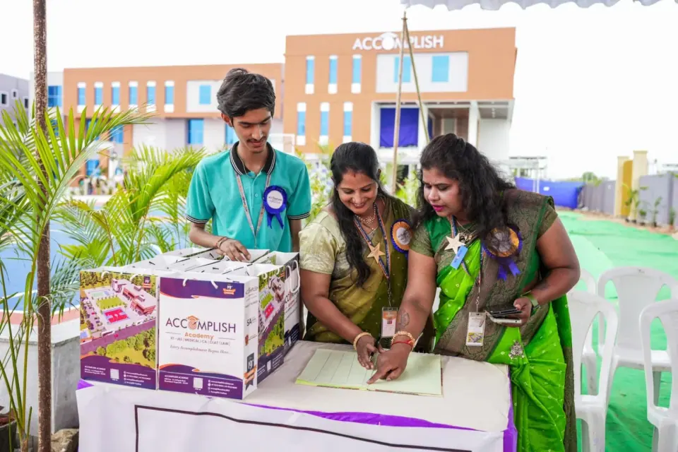 A student and staff members at a campus ceremony