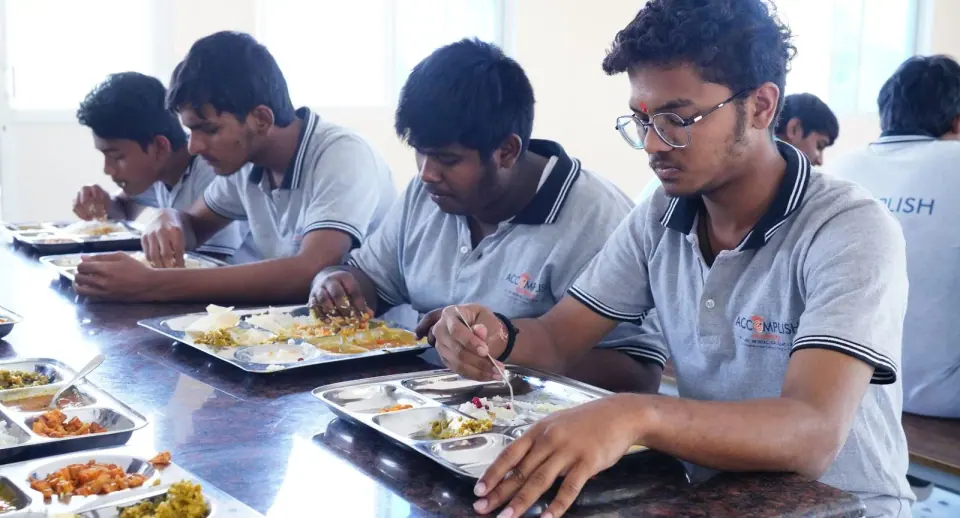 Students having a meal together in the dining hall